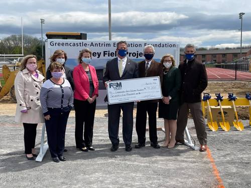 representatives from United Trust Bank and GAEF pose for a photo