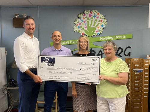 representatives from United Trust Bank and WCHS pictures during check presentation